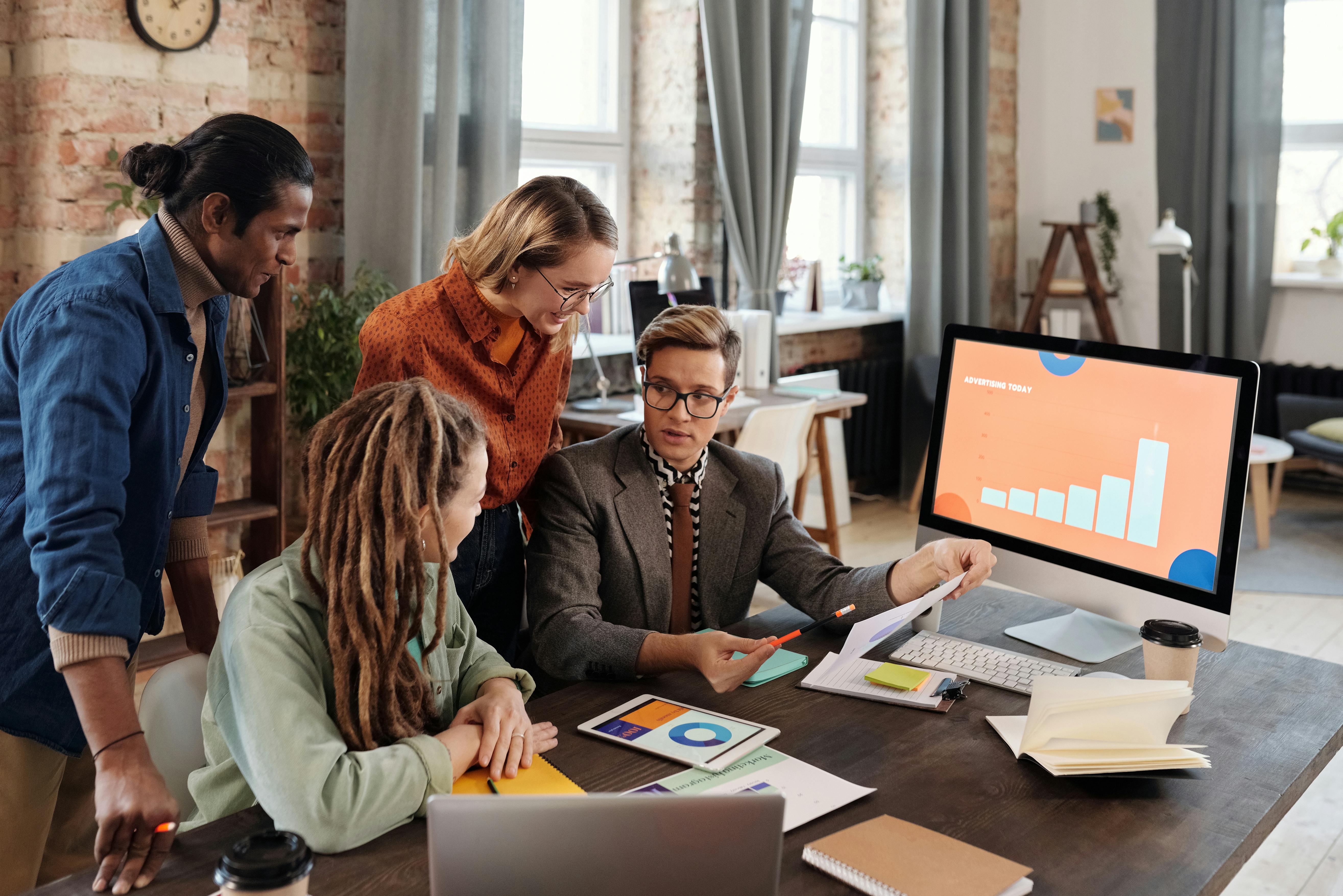 Marketing team collaborating in office
